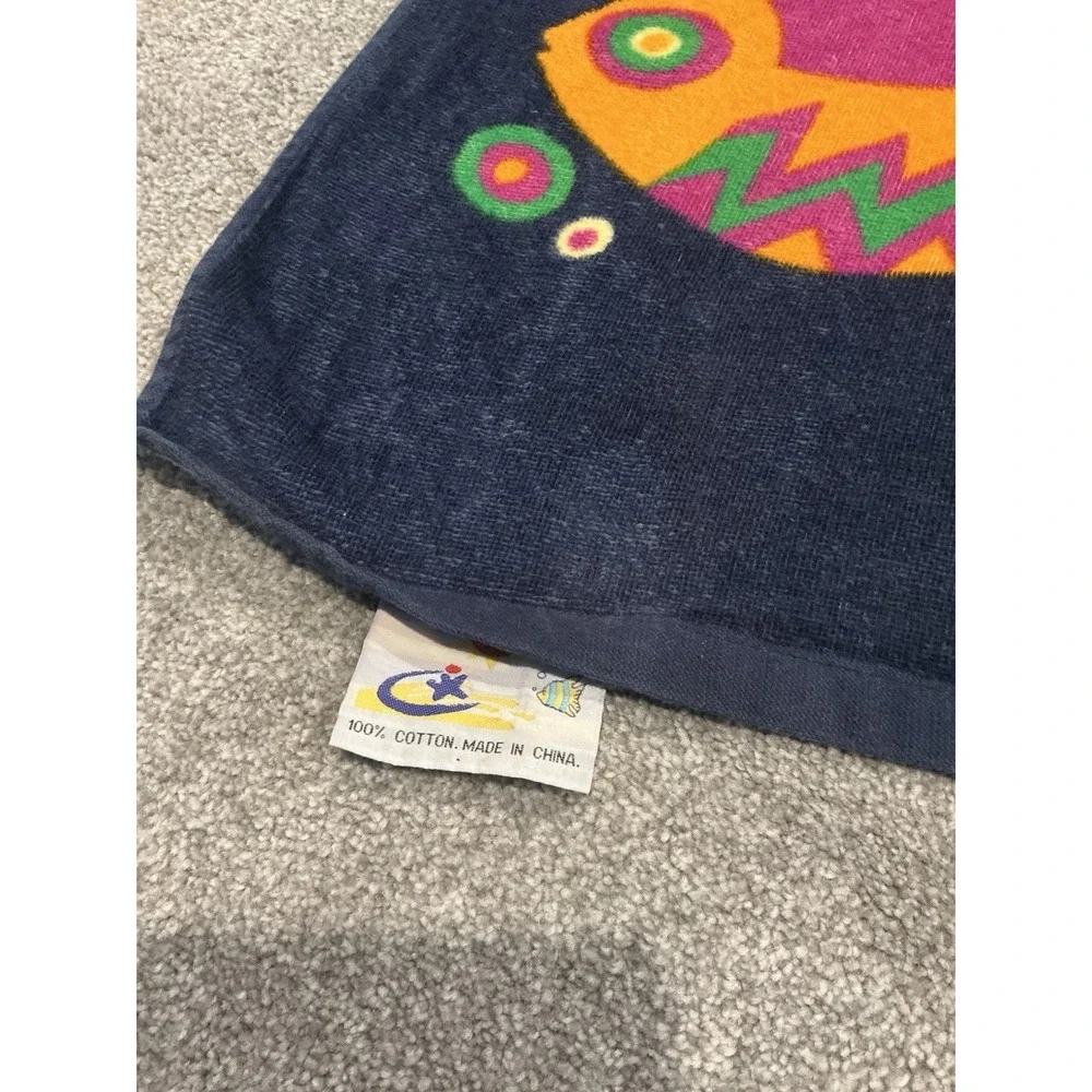 Vintage Beach Towel Featuring A Colorful Tropical Fish and Sailboat Design